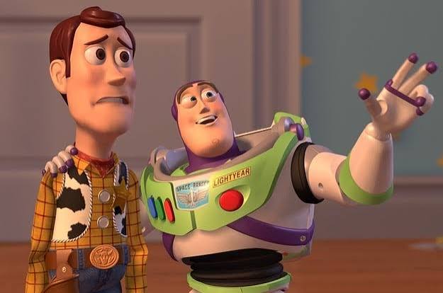 Buzz Lightyear, smiling, sweeps his arm toward the horizon while a worried Woody looks on, a still from Toy Story